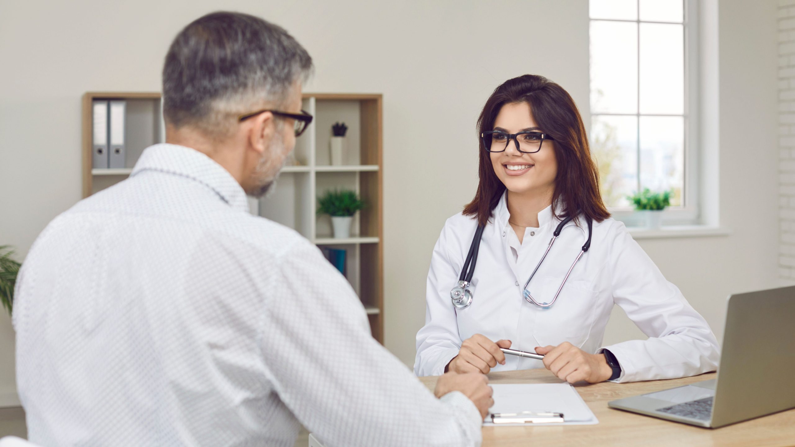 An interviewer at a residency program answering questions asked by a prospective resident.